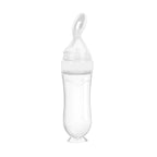 Išspaudžiamas kūdikių maitinimo buteliukas su šaukšteliu
